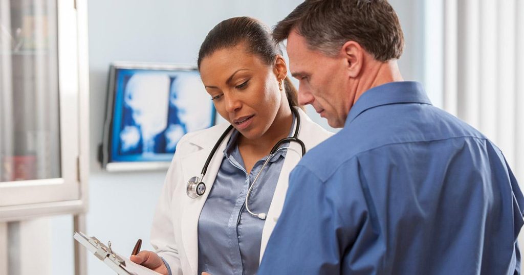 “Doctors discussing idiopathic pulmonary fibrosis treatment and Pirfenidone side effects