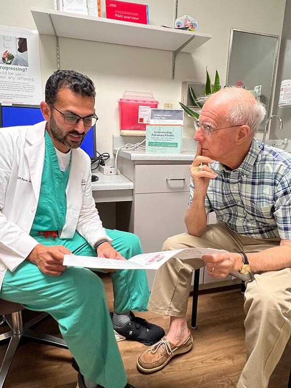 Doctor explaining nintedanib side effects to pulmonary fibrosis patient