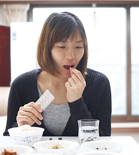 “Patient taking Pirfenidone medication with food to reduce gastrointestinal side effects”
